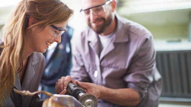 Man and woman wearing goggles working.